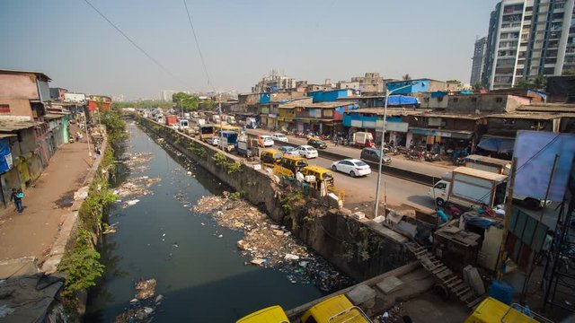 Daytime traffic in a poor area of Mumbai Dharavi. India.