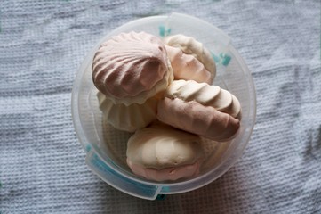 Pink and white marshmallows in a plastic bowl!