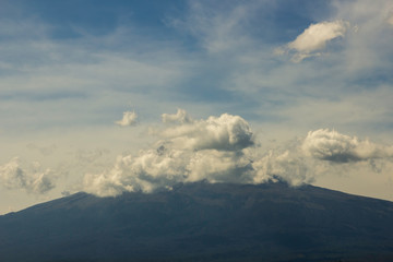 Popocatepetl active volcano, blue sky erupting