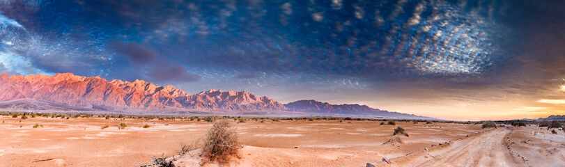 Panorama with colorful sunset in desert area of nature reserve and ecological ancient park -...