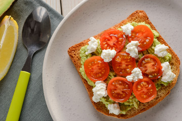 Toast with tomato, ricotta and avocado. Yummy snack