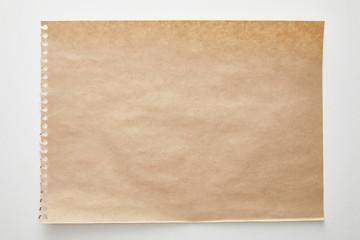 top view of empty craft paper on white background
