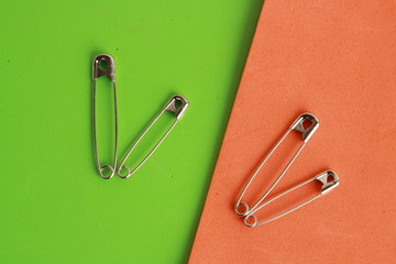 sewing pin on colorful background