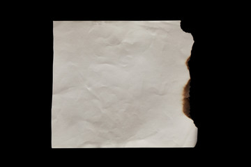 top view of empty burnt vintage paper isolated on black