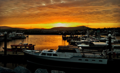 Beautiful Orange sunset above Dingle Marina in Ireland.