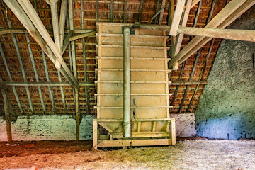 Wooden feed silo in the attic