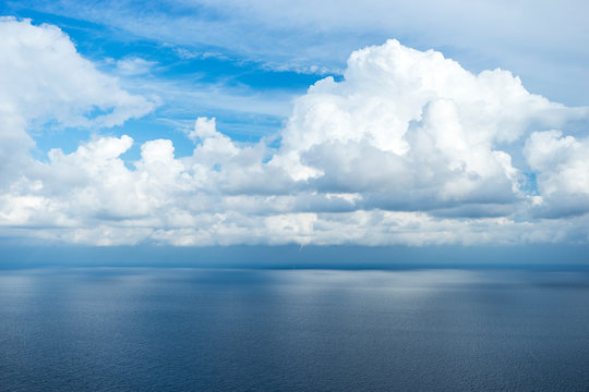 Horizon between sky and sea on a cloudy and calm day