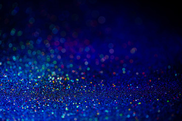 Classic blue color of the year 2020. Bokeh lights with bright shiny effect. Overlapping glowing and...