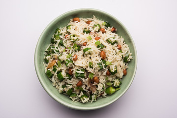 Okra or Bhindi rice also known as Vendakkai Sadam, served in a bowl, selective focus