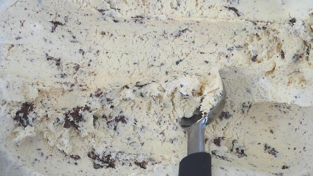 Hands scoop Cookies & Cream ice cream. Food background concept, Blank for design.