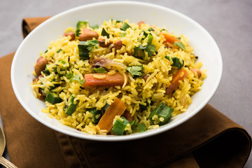 Okra or Bhindi rice also known as Vendakkai Sadam, served in a bowl, selective focus
