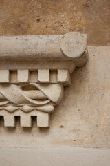 fragment of an old window sill made of light stone