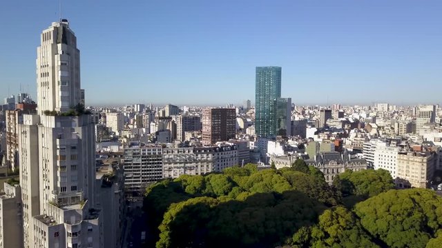 Aerial of Kavanagh building casting a long shadow over Plaza San Martin, Buenos Aires