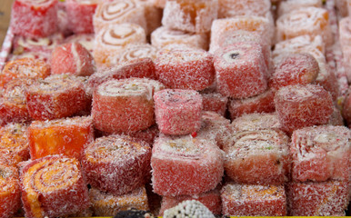 Assorted traditional turkish delight . traditional sweets, rahat lukum in counter in the market.