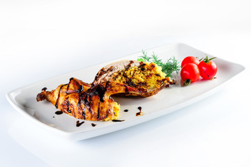 quail stuffed on a white plate