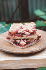 Homemade raspberry crumble bar on plate