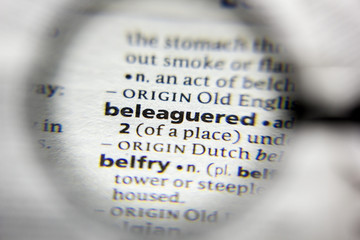 The word or phrase beleaguered in a dictionary.