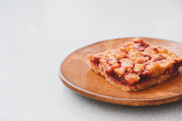 Homemade raspberry crumble bar on plate