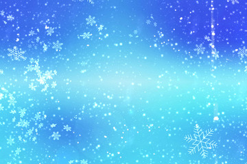 Blue Christmas background for holidays. Christmas decoration with snowflakes on a blue background defocused. Copy space.