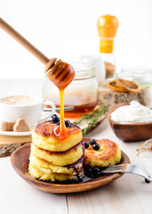 Cottage cheese pancakes with honey. Breakfast or Lunch Concept.