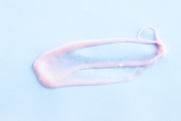 Lotion on white paper background