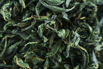 Close-up - collection of dried green tea leaves .Top view. Macro photo.