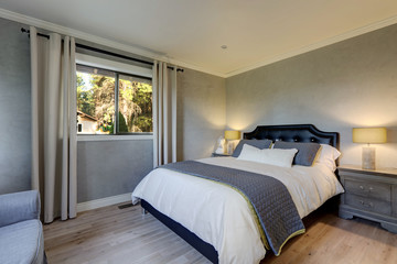 Grey elegant classic guest bedroom with venetian plaster walls and oak modern tone floor