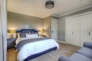 Grey elegant classic guest bedroom with venetian plaster walls and oak modern tone floor