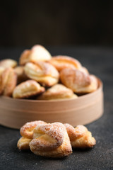 Homemade cookies with cottage cheese in a rustic bowl on a dark background.