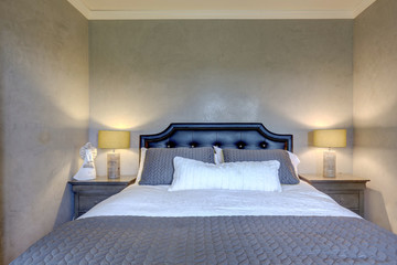 Grey elegant classic guest bedroom with venetian plaster walls and oak modern tone floor