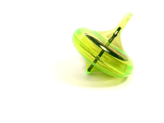 Whirligig isolated on a white background. Green whirligig for children. Children's toy. A classic toy for development. 