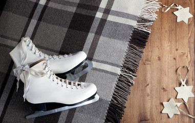 pair of white figure skates, plaid and star tree decoration