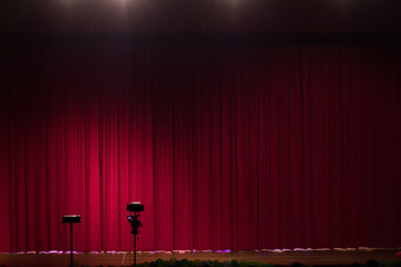 theater stage with red curtains and spotlights