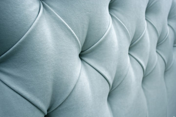 Upholstery back of the sofa for the background. Blue velour on the back of the sofa. Selective...