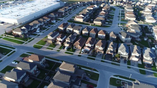 90 Degree Aerial Panorama Of Neighbourhood Houses Near Sunset And Commercial District Stores
