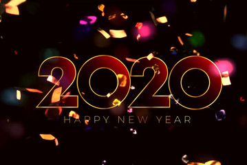 Text 2020 HAPPY NEW YEAR with golden ribbon on black background.