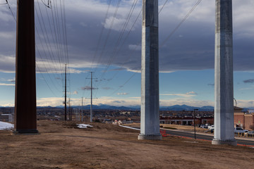 Transmission power lines in Parker, Colorado with a view of the mountains