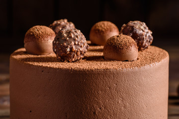Christmas holiday table with delicious truffle cake and beautiful gingerbreads