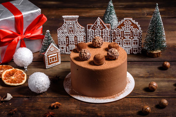 Christmas holiday table with delicious truffle cake and beautiful gingerbreads