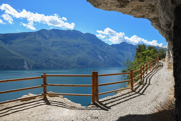 tourist attraction above garda lake, old ponale road trail under overhanging rocks