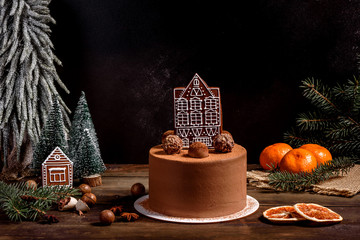 Christmas holiday table with delicious truffle cake and beautiful gingerbreads