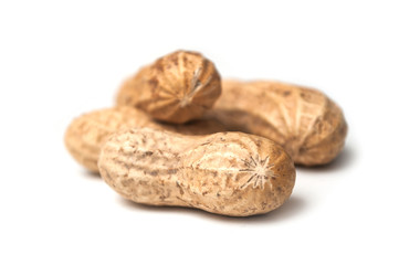 closeup of organic peanuts on white background