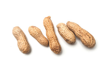 closeup of organic peanuts on top view on white background
