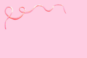 pink sequin strip frame on a pastel pink background