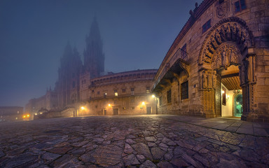 Santiago de Compostela, Spain. View of Praza do Obradoiro square in front of Cathedral with strong morning fog - obrazy, fototapety, plakaty