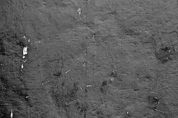 Texture of a concrete wall with cracks and scratches which can be used as a background