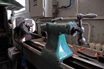 An old metalworking machine in a workshop.