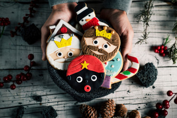 man with christmas cookies in his hands