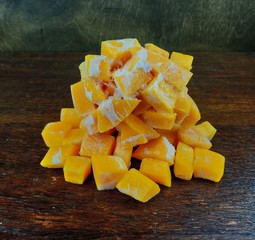 slices of pumpkin on wooden table
