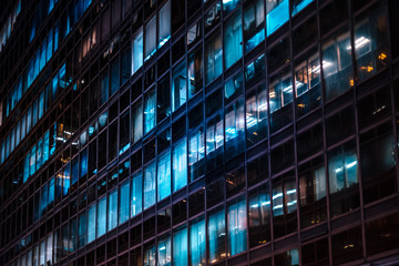 Obraz premium office building facade at night - business district -
